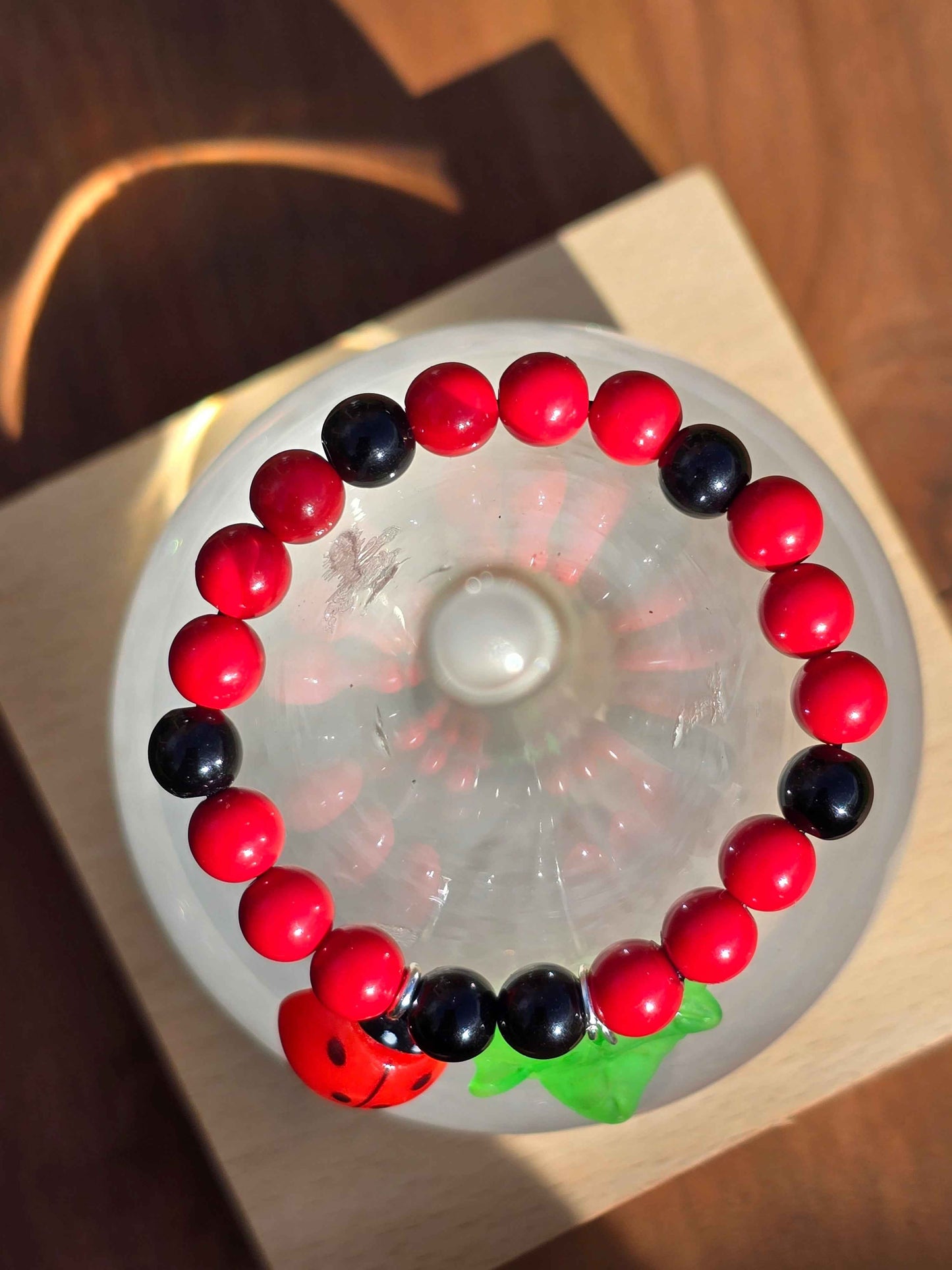 top down shot of a Kids ladybird themed bracelet
