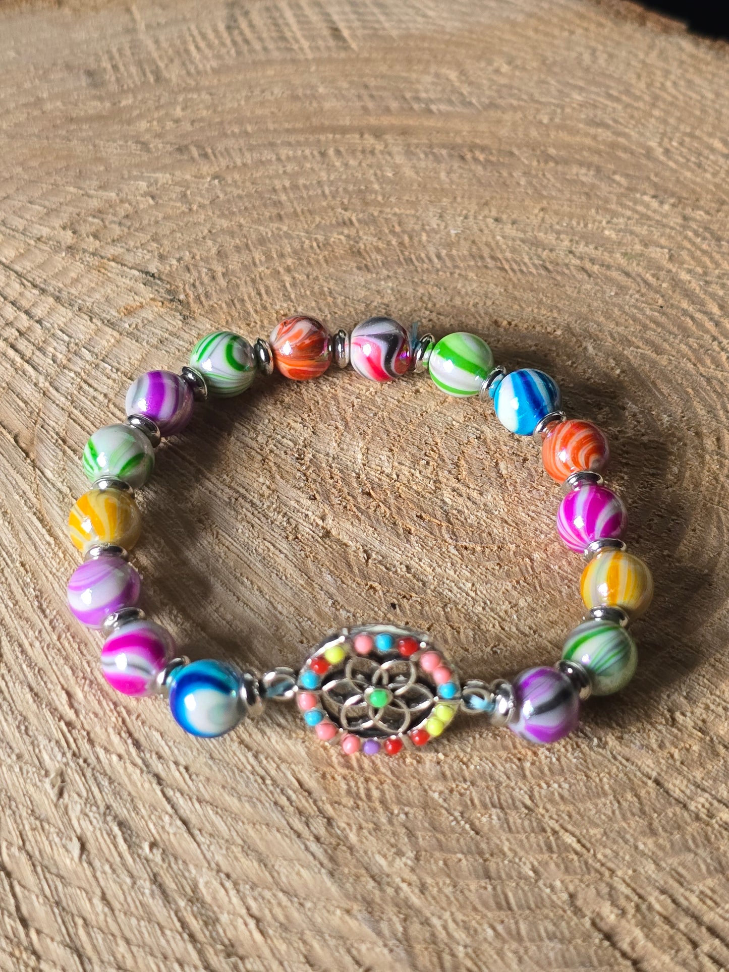 Kids beaded bracelet, multicoloured elastic bracelet with various colourful charms