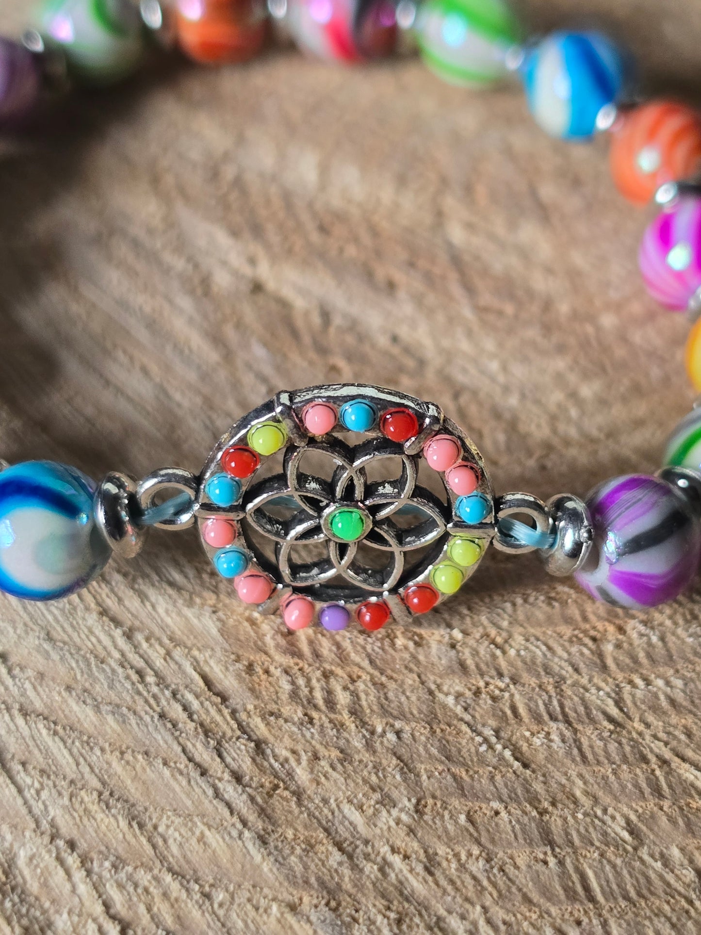 Kids beaded bracelet, multicoloured elastic bracelet with various colourful charms
