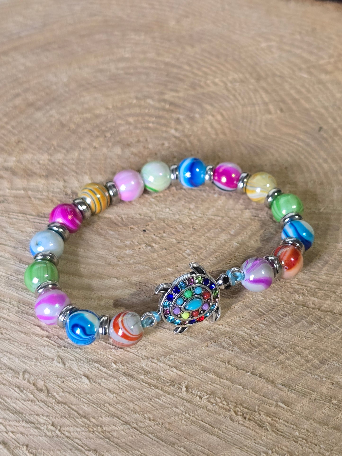 Kids beaded bracelet, multicoloured elastic bracelet with various colourful charms