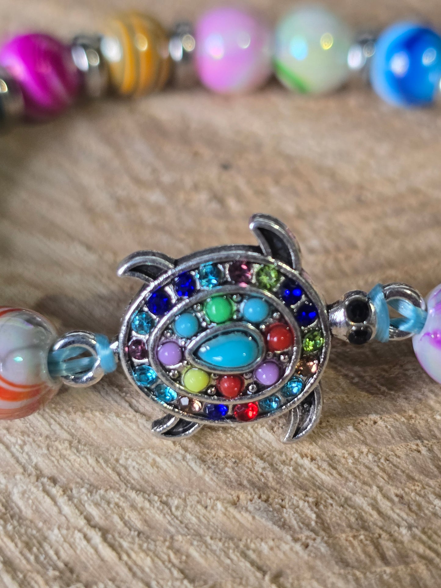 Kids beaded bracelet, multicoloured elastic bracelet with various colourful charms