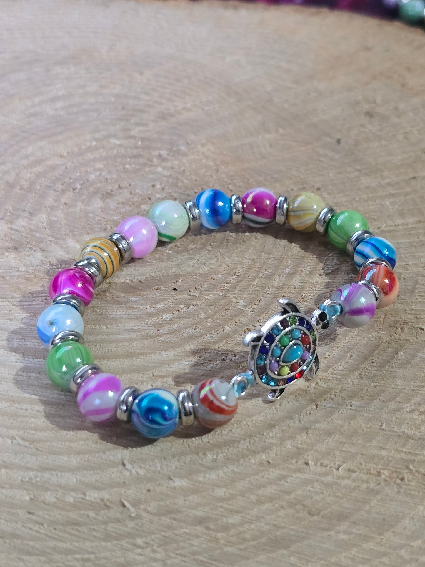 Kids beaded bracelet, multicoloured elastic bracelet with various colourful charms