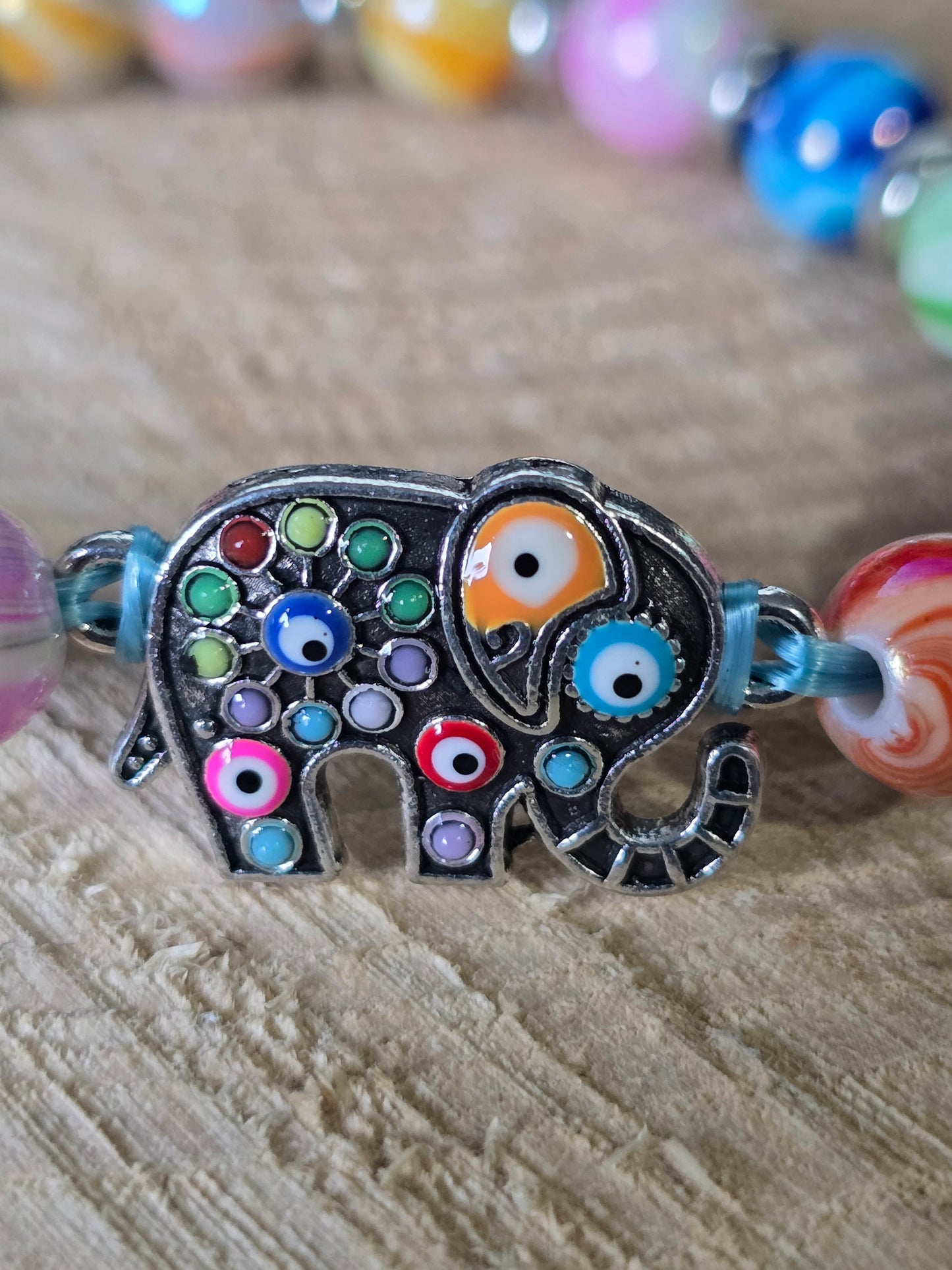 Kids beaded bracelet, multicoloured elastic bracelet with various colourful charms