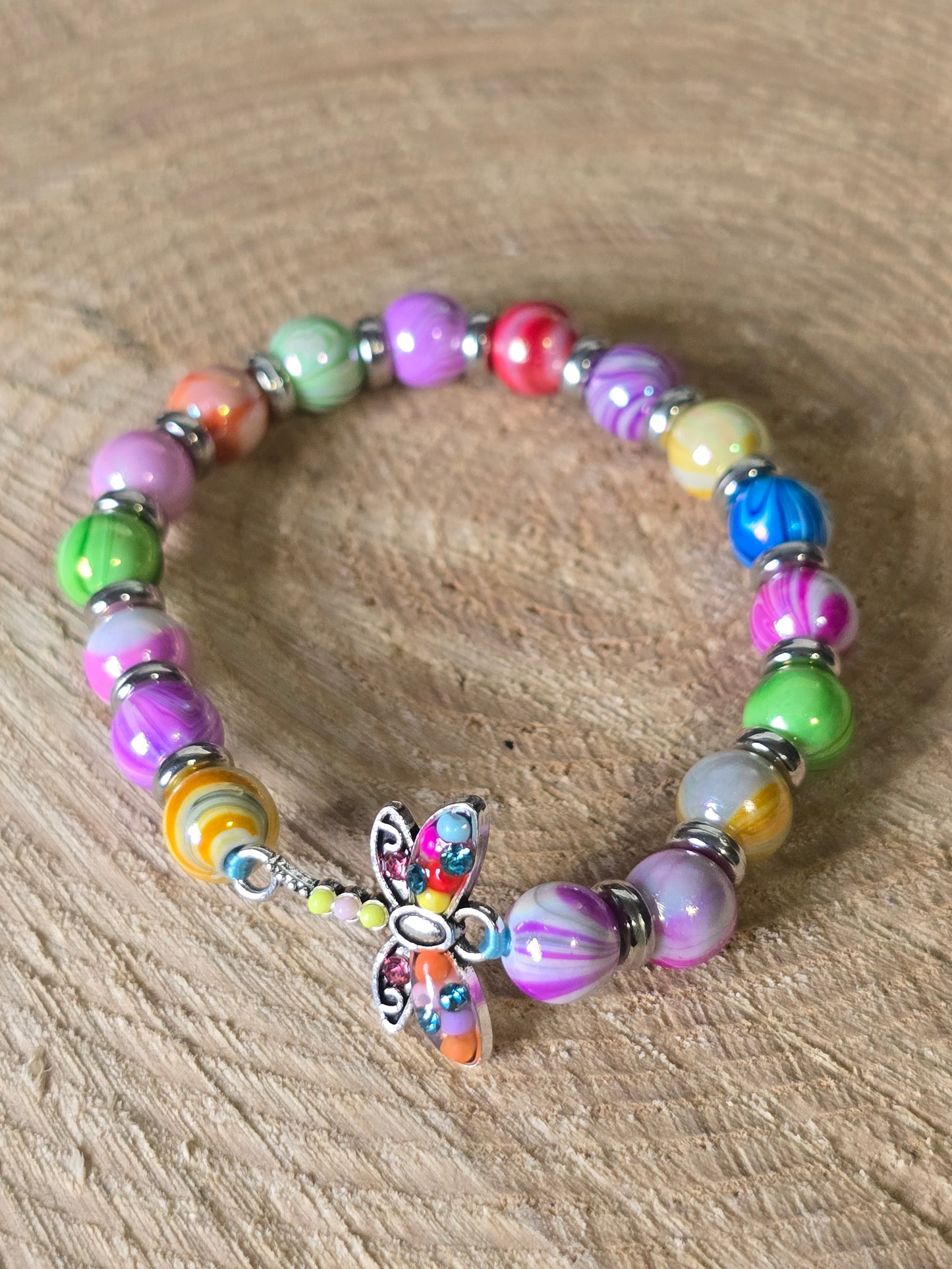 Kids beaded bracelet, multicoloured elastic bracelet with various colourful charms