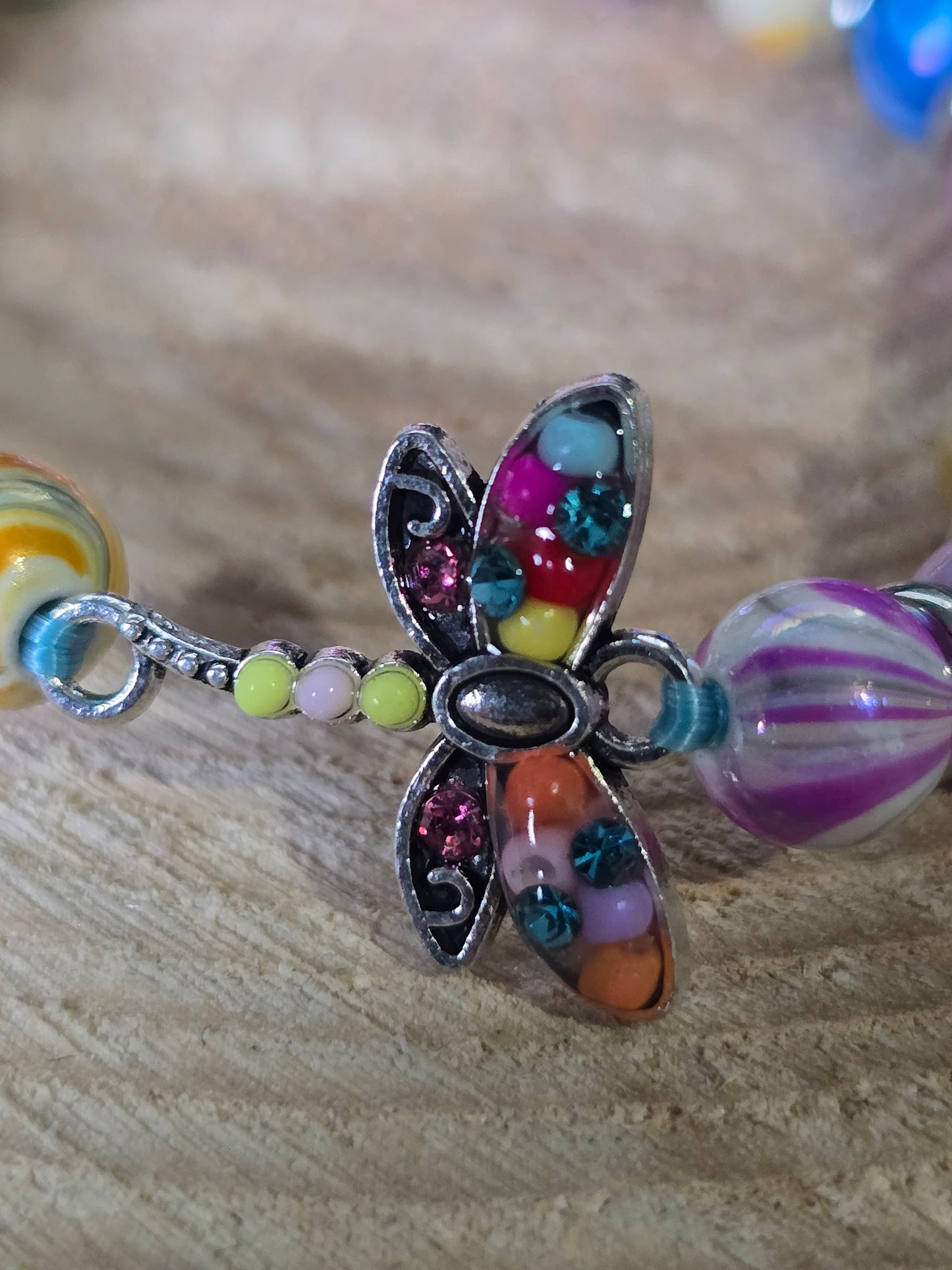 Kids beaded bracelet, multicoloured elastic bracelet with various colourful charms