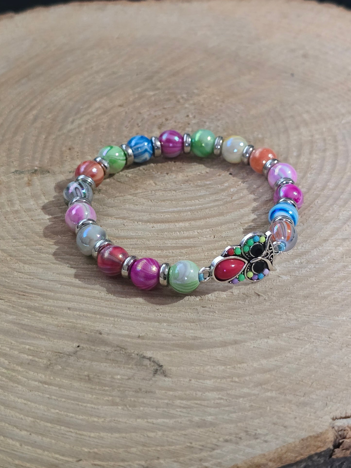 Kids beaded bracelet, multicoloured elastic bracelet with various colourful charms