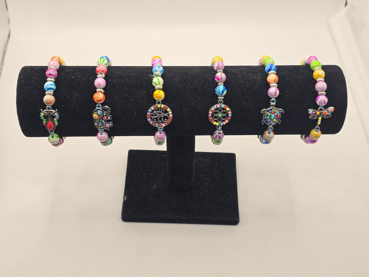 Kids beaded bracelet, multicoloured elastic bracelet with various colourful charms
