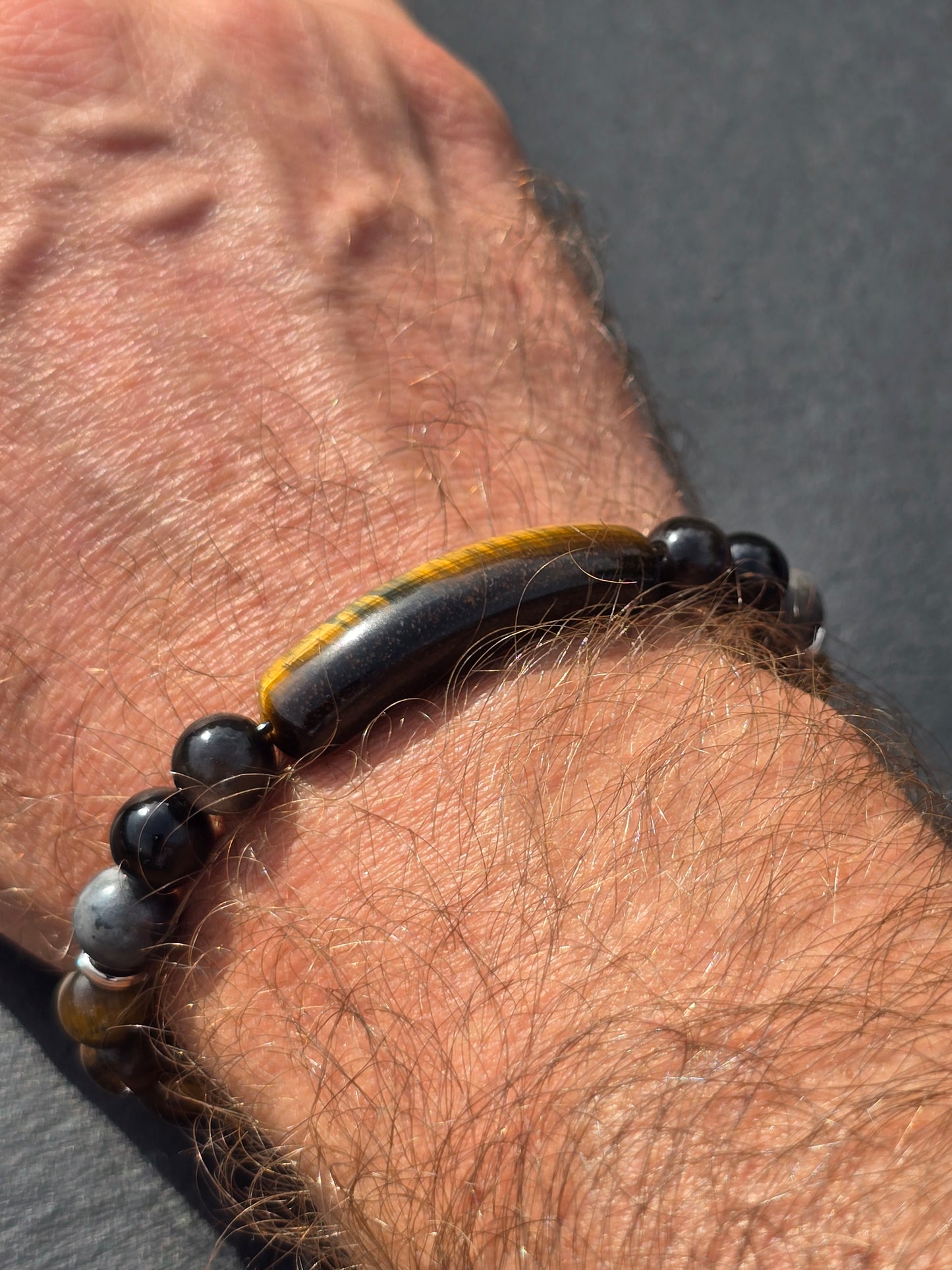 Men's tigers eye beaded bracelet being worn