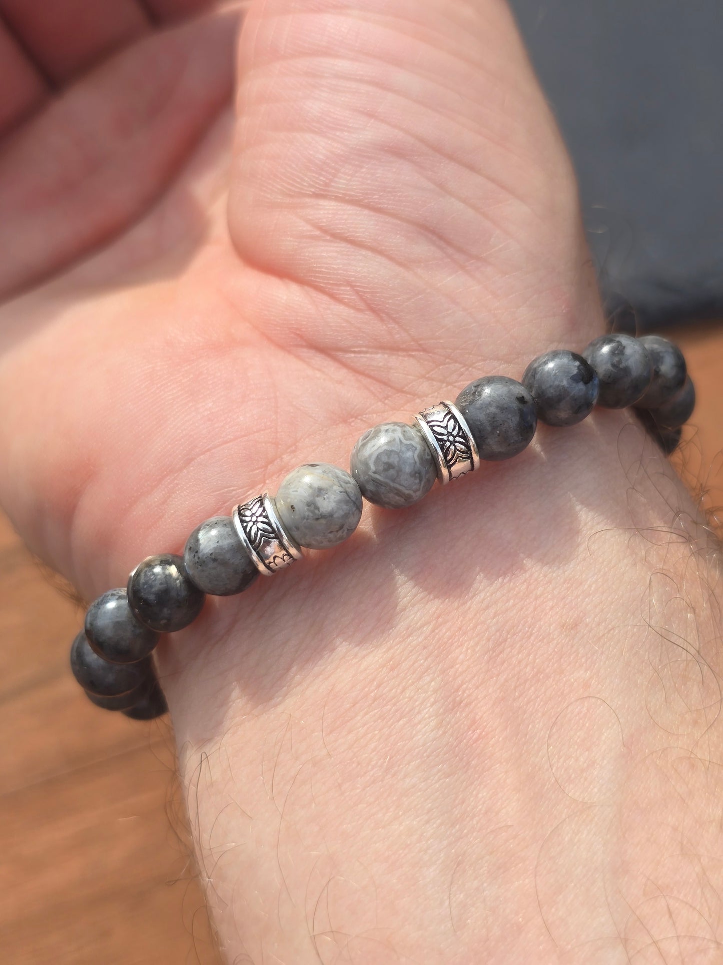 Reverse side of a mens grey charcoal beaded bracelet with marble effect