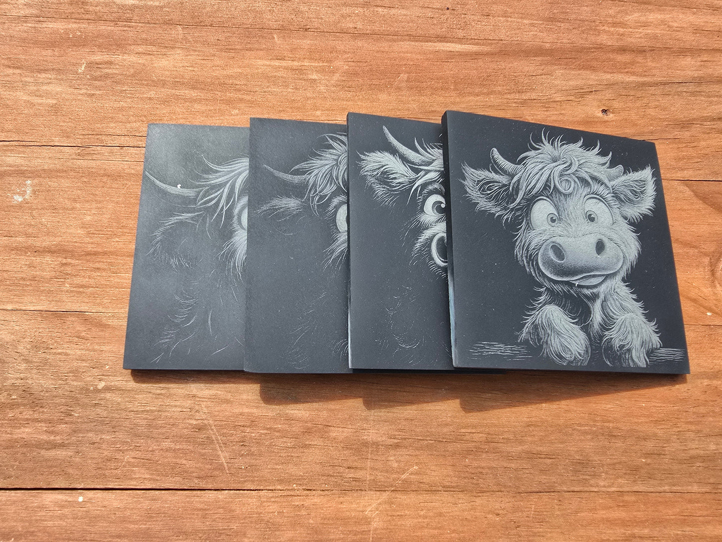 4 pack of Highland cow slate coasters with 4 different designs