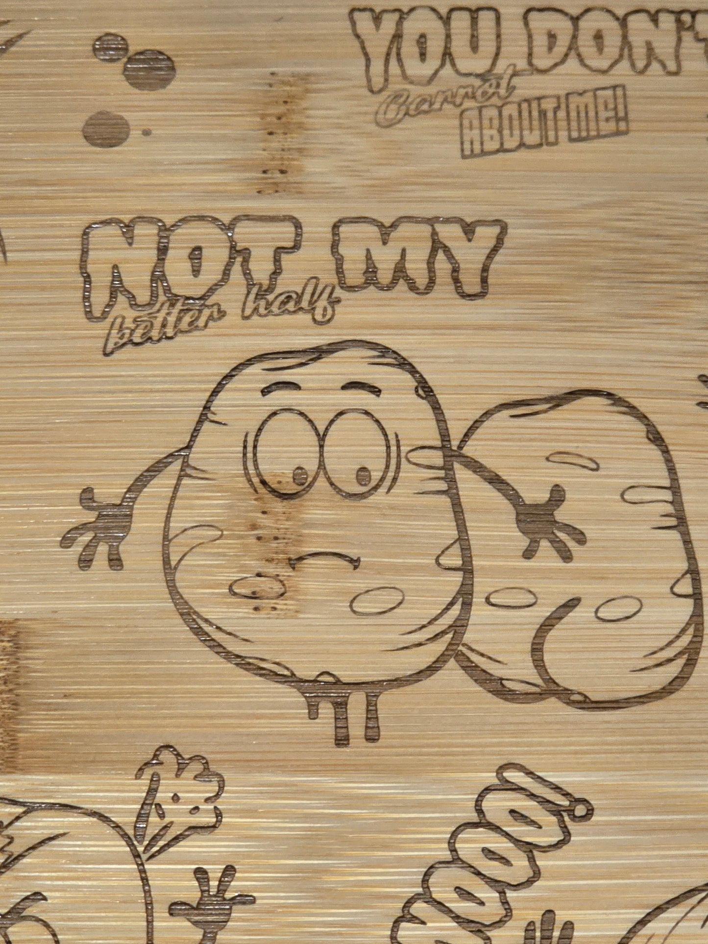Cartoon potato character with text on a wooden chopping board