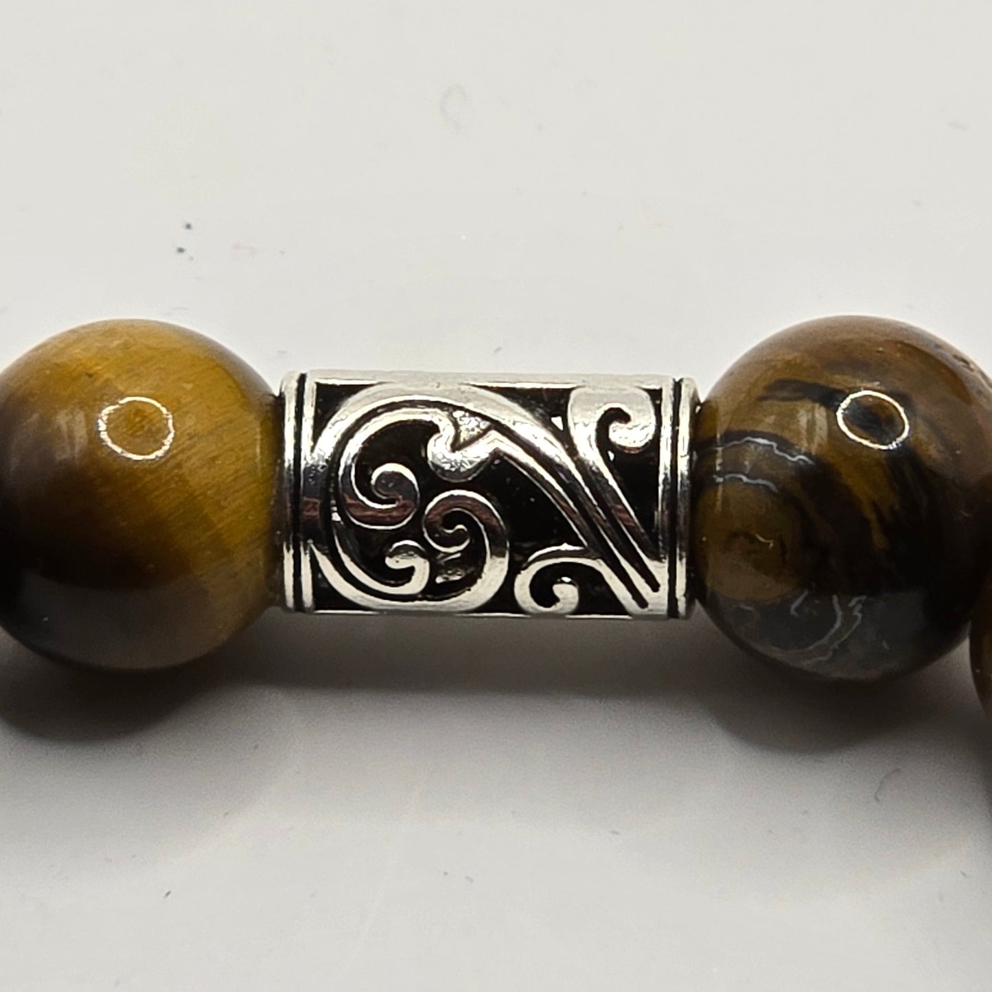 silver spacer on a tigers eye bracelet