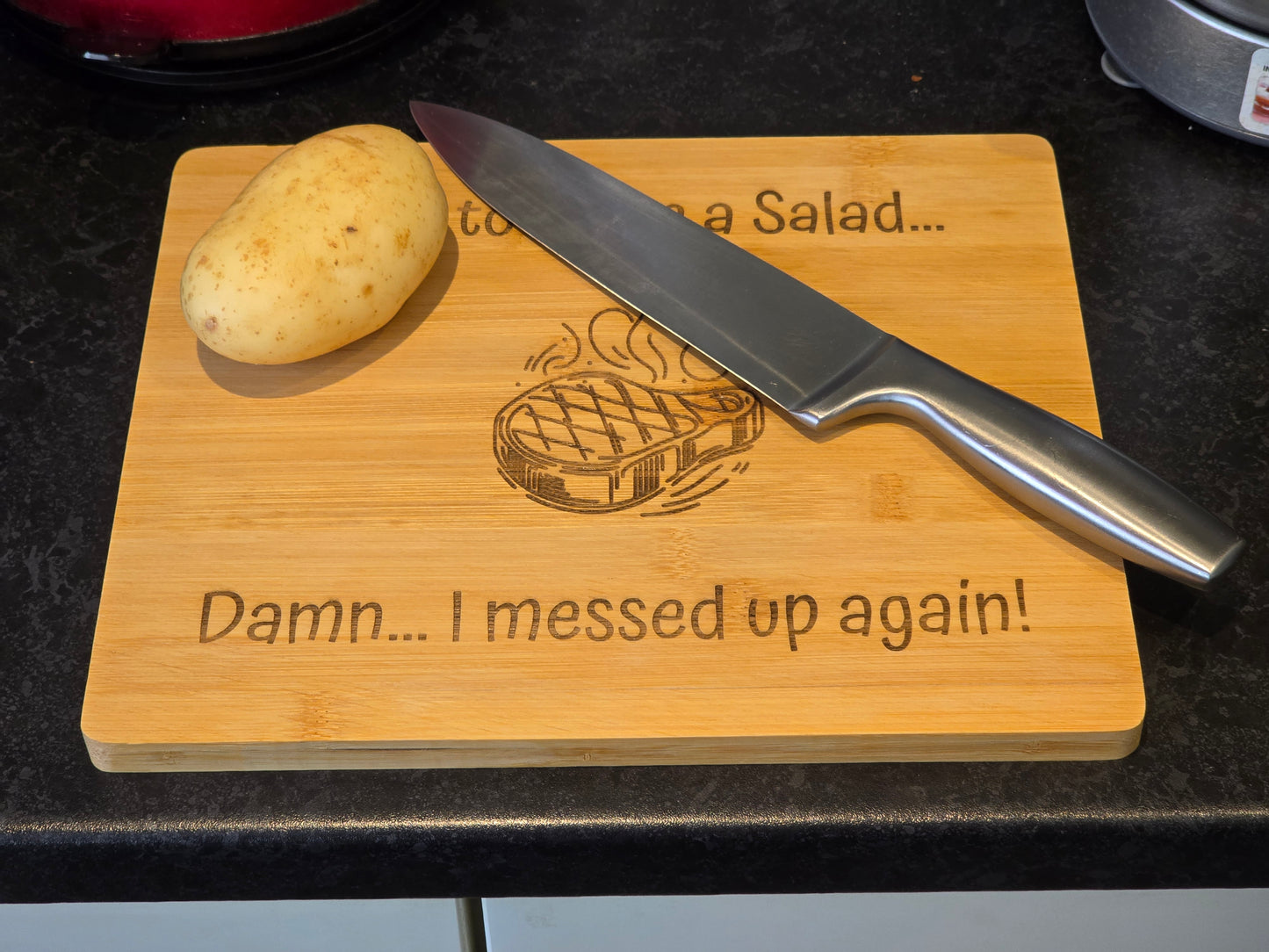 Wooden cutting board with a potato and knife, featuring humorous text and graphics.