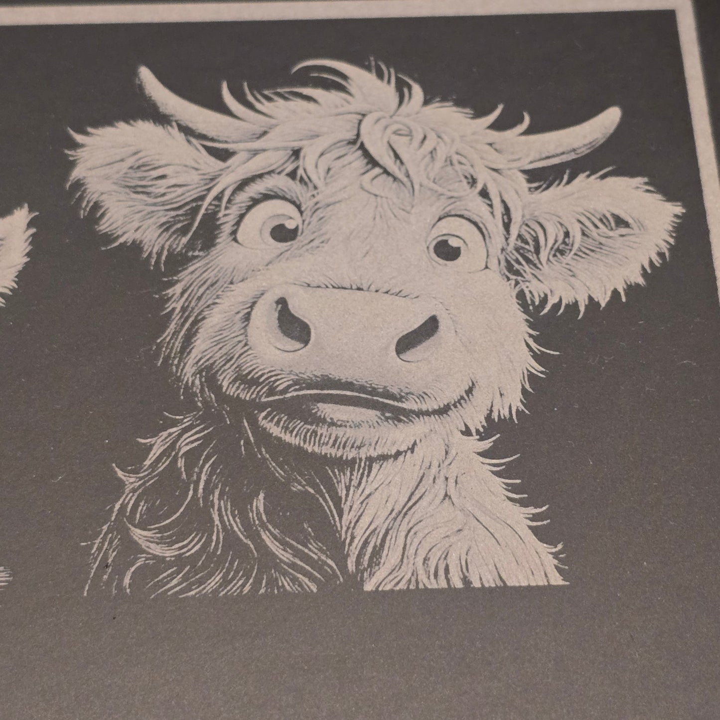 Female cute highland cow engraving on a slate board