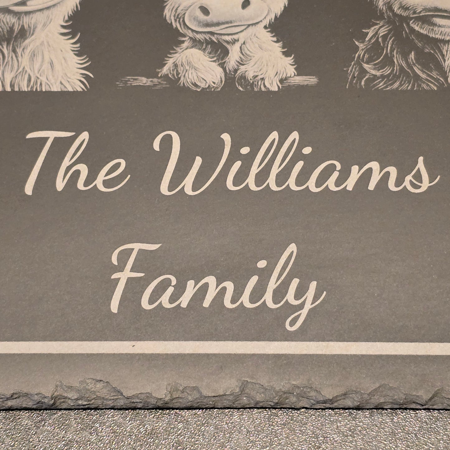 Decorative sign with personalised 'The Williams Family' text and highland cow designs