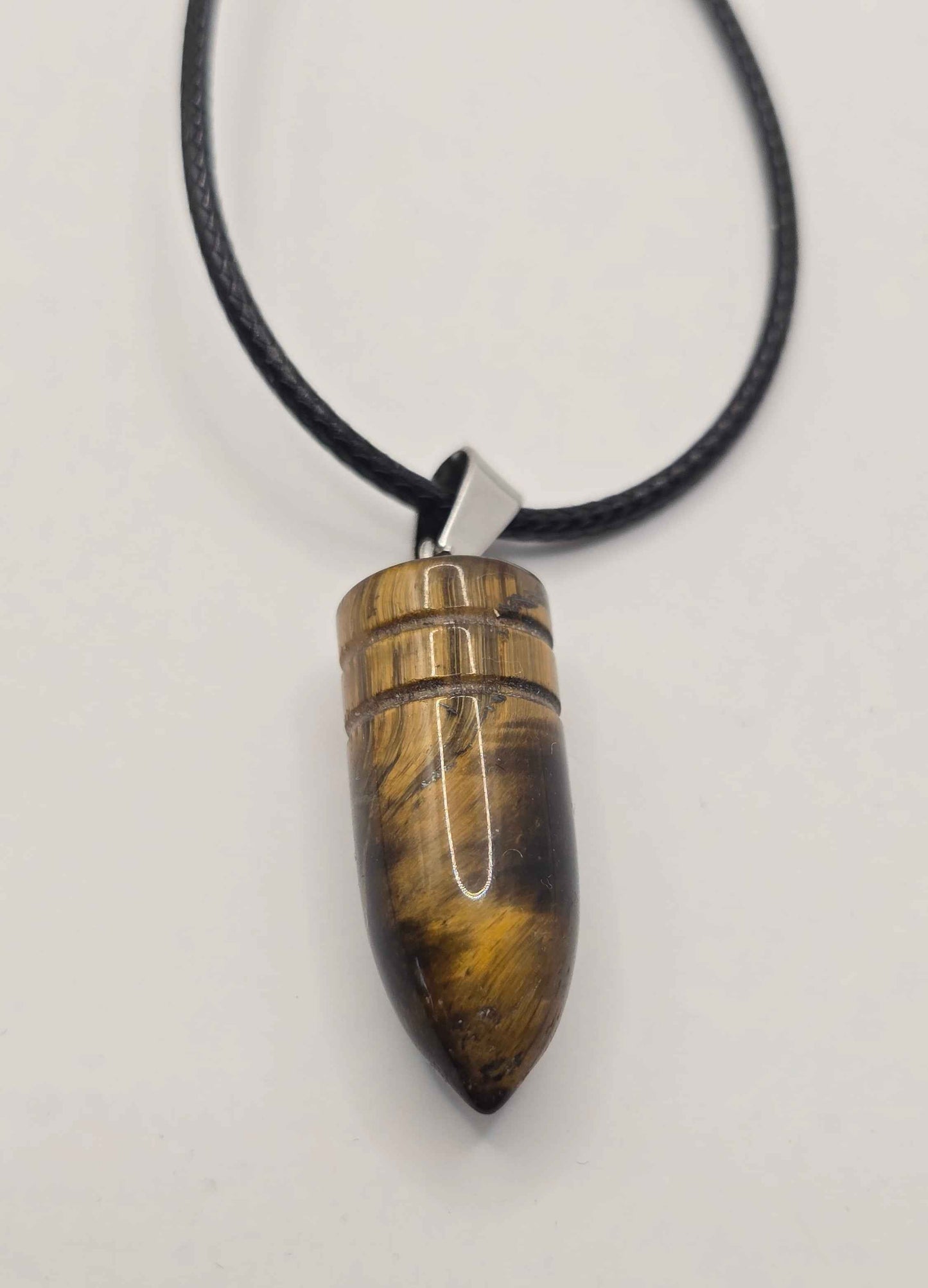 Men's Tiger's eye stone pendant on a black cord against a light Gray background
