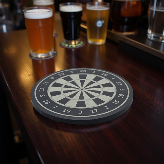 Slate Dartboard coaster on a wooden surface with glasses of beer in the background
