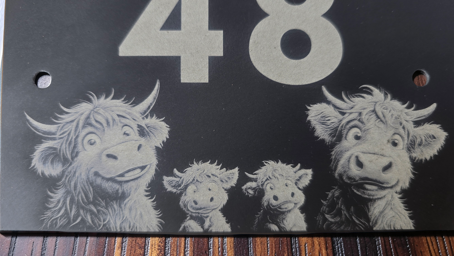 Decorative slate house plaque with four cartoon-style highland cows and the number 48 on a dark background.