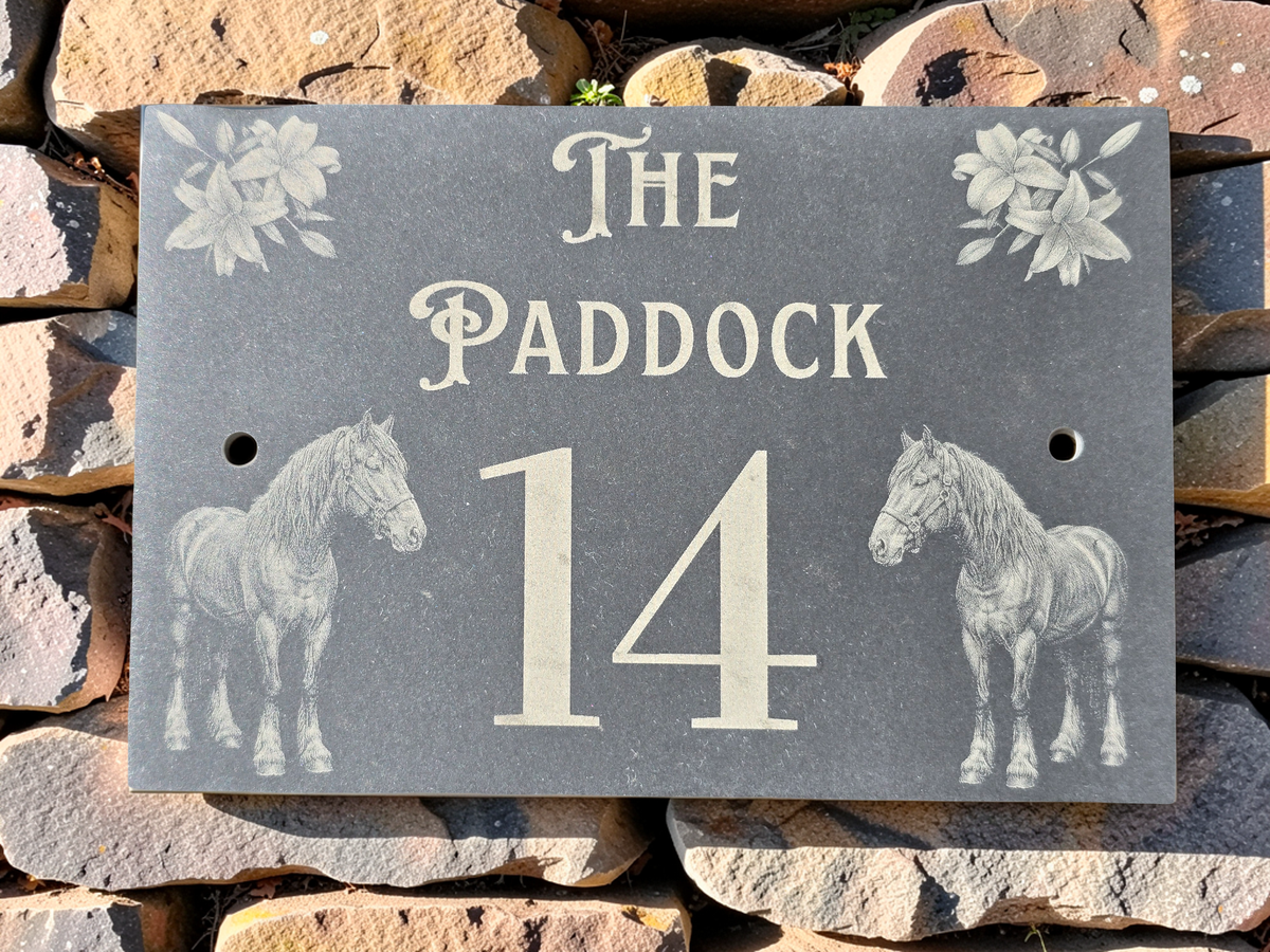 Slate house sign reading The Paddock 14, engraved with two draft horses and corner lily illustrations.