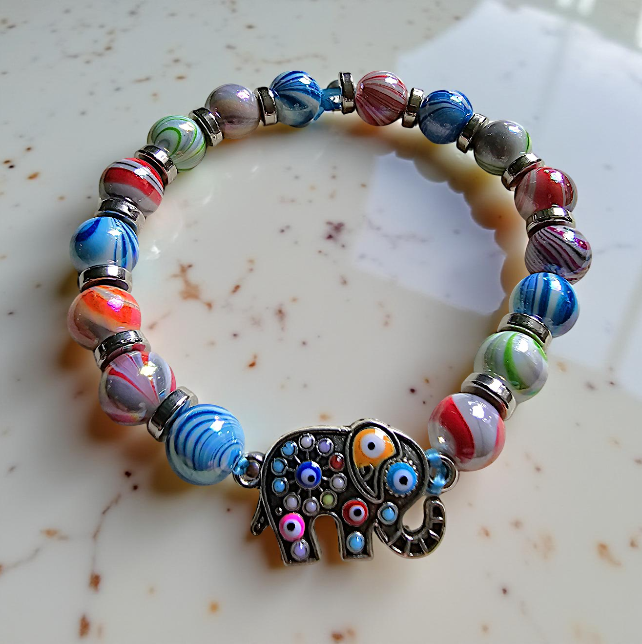 Kids beaded bracelet, multicoloured elastic bracelet with various colourful charms