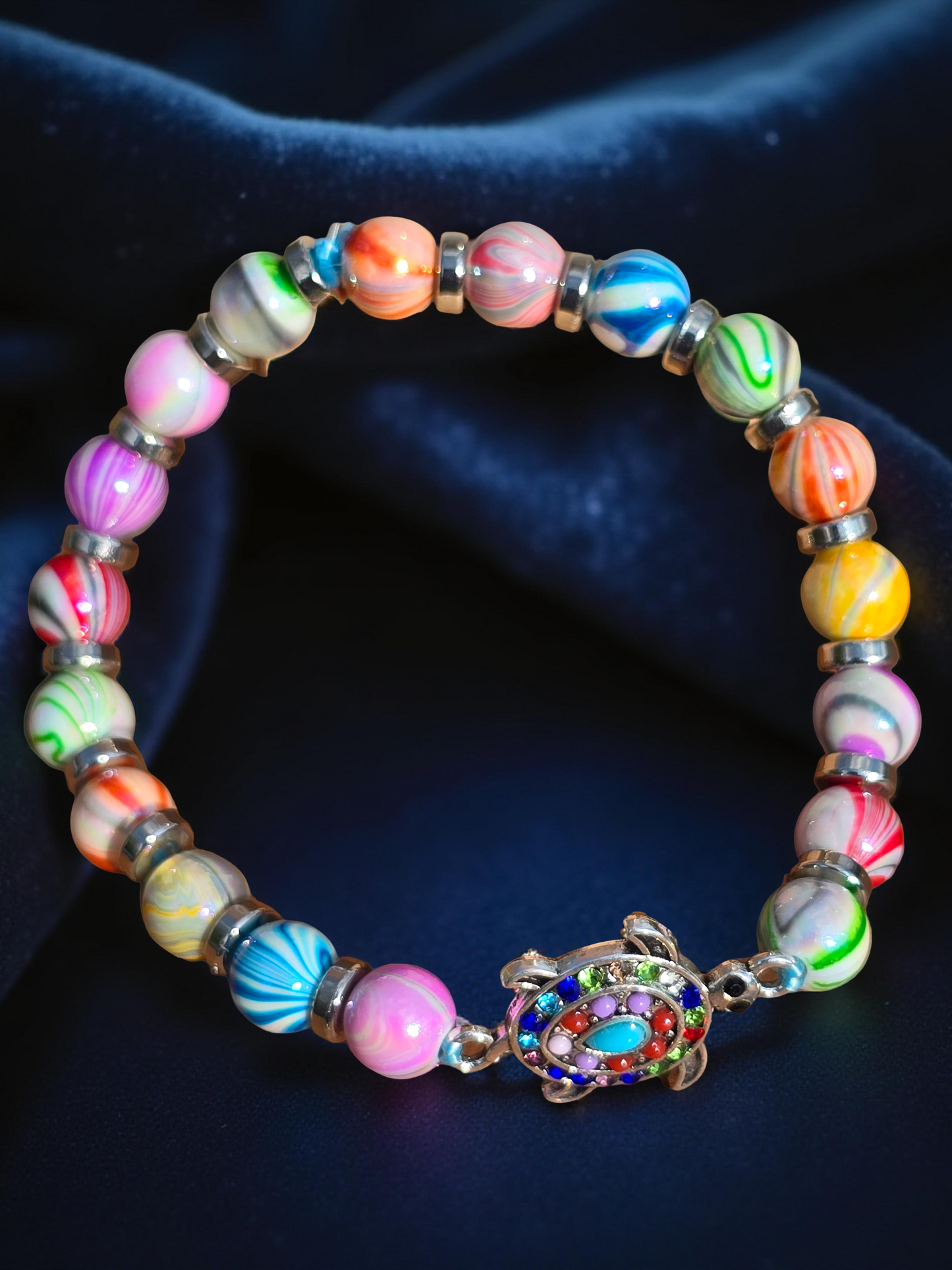 Kids beaded bracelet, multicoloured elastic bracelet with various colourful charms