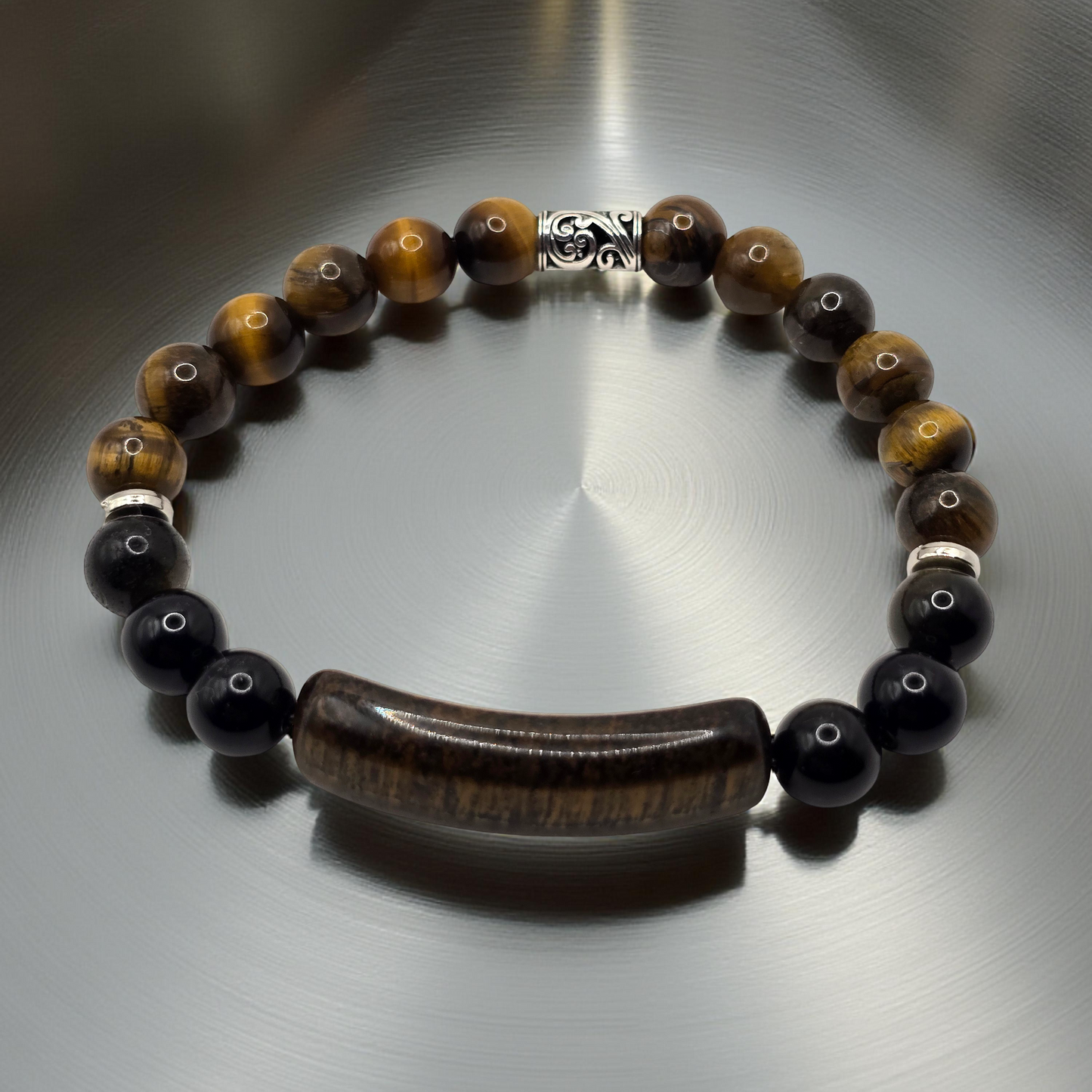 Men's Beaded bracelet with brown and black beads on a reflective surface