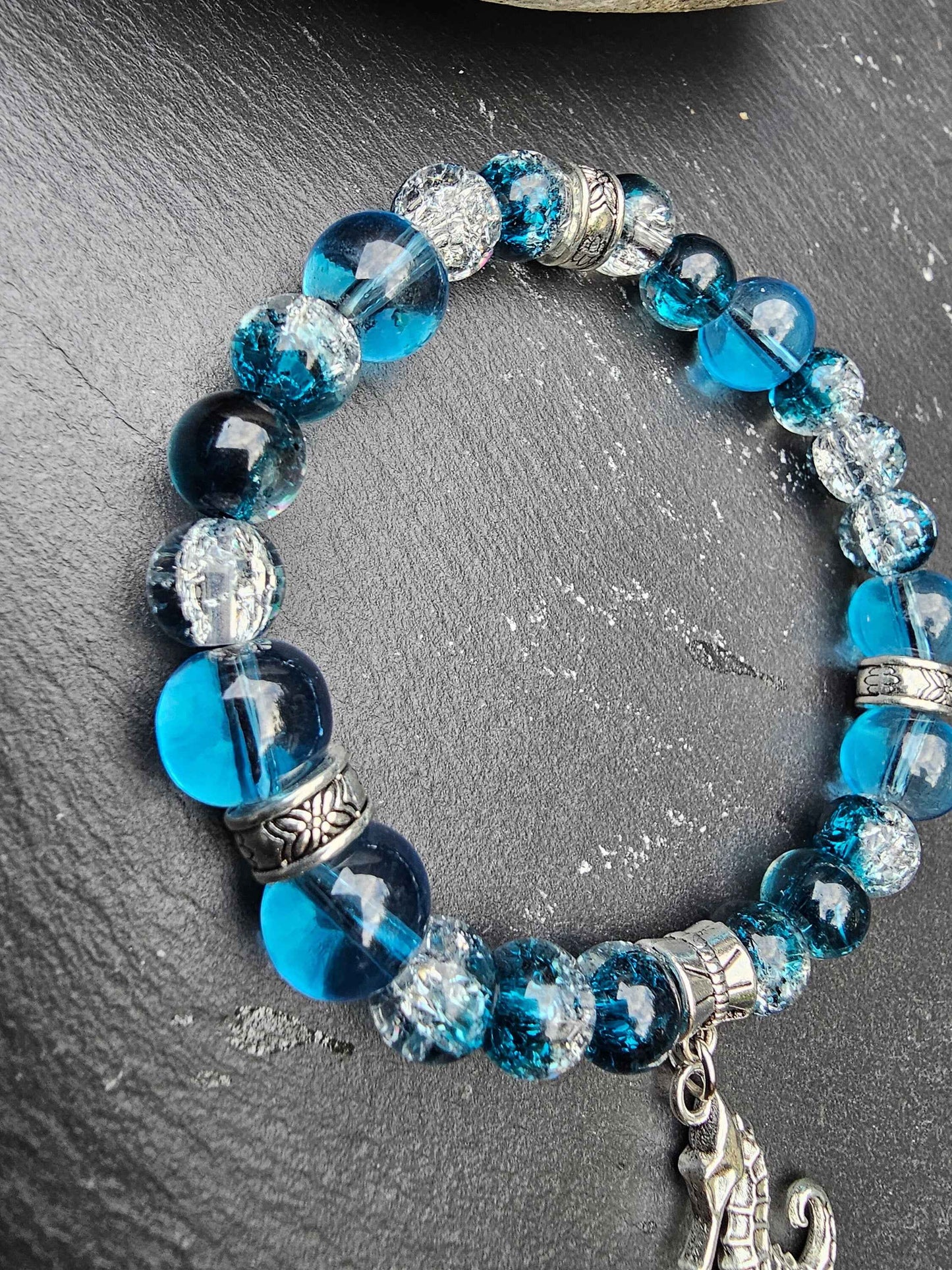 Seahorse charm beaded bracelet - Blue and clear glass beads and elasticated band to fit most wrist sizes