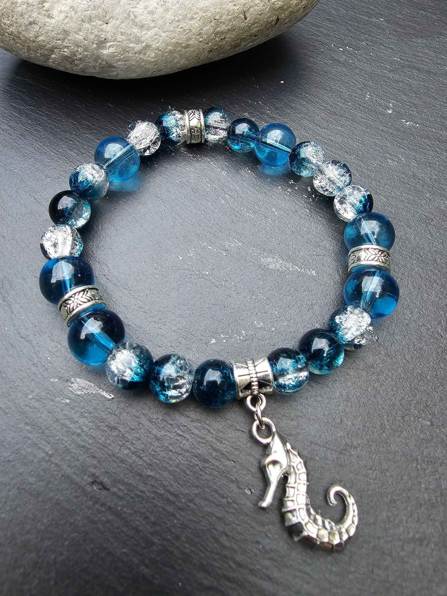 Seahorse charm beaded bracelet - Blue and clear glass beads and elasticated band to fit most wrist sizes