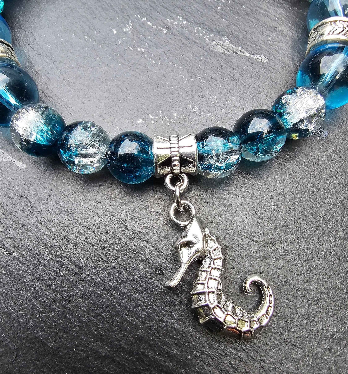 Seahorse charm beaded bracelet - Blue and clear glass beads and elasticated band to fit most wrist sizes