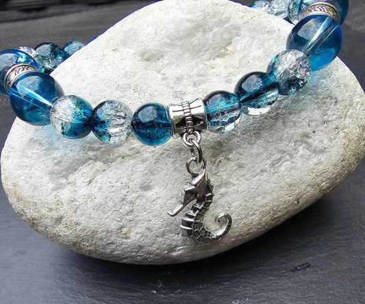 Seahorse charm beaded bracelet - Blue and clear glass beads and elasticated band to fit most wrist sizes