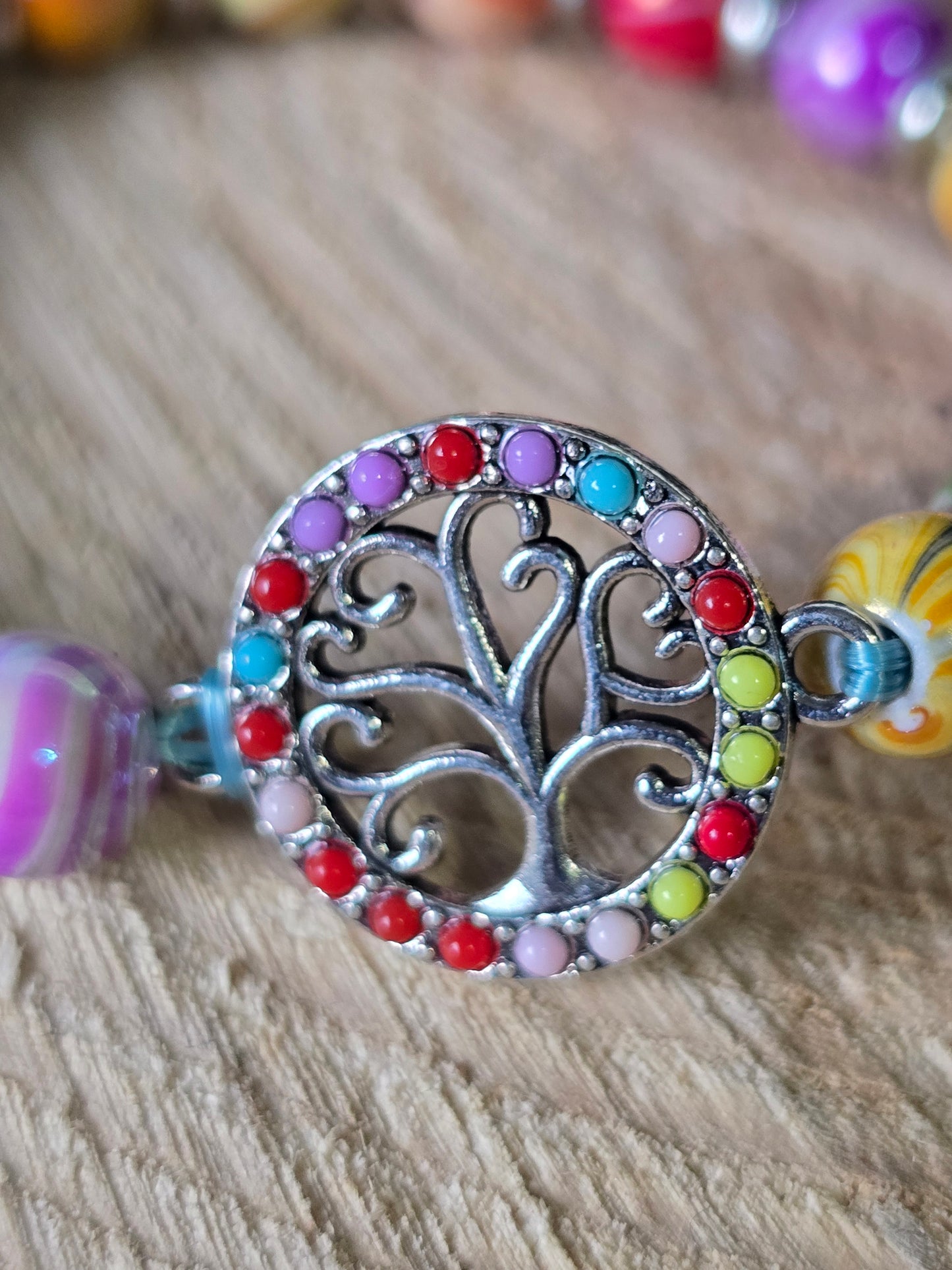 Kids beaded bracelet, multicoloured elastic bracelet with various colourful charms