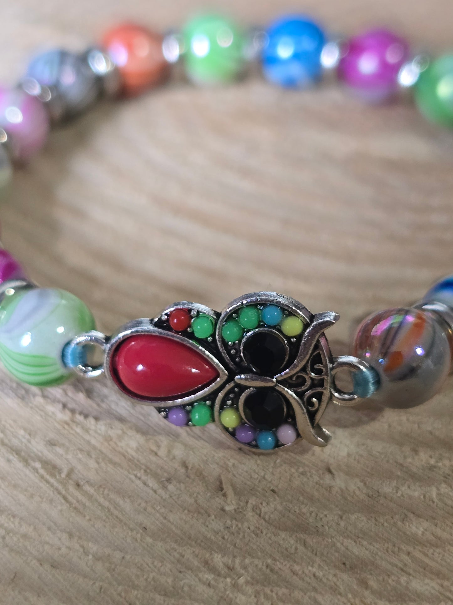 Kids beaded bracelet, multicoloured elastic bracelet with various colourful charms
