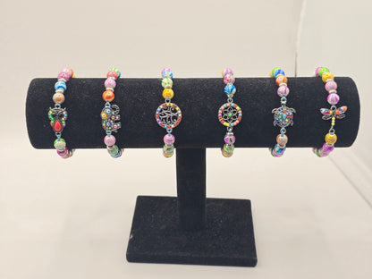 Kids beaded bracelet, multicoloured elastic bracelet with various colourful charms