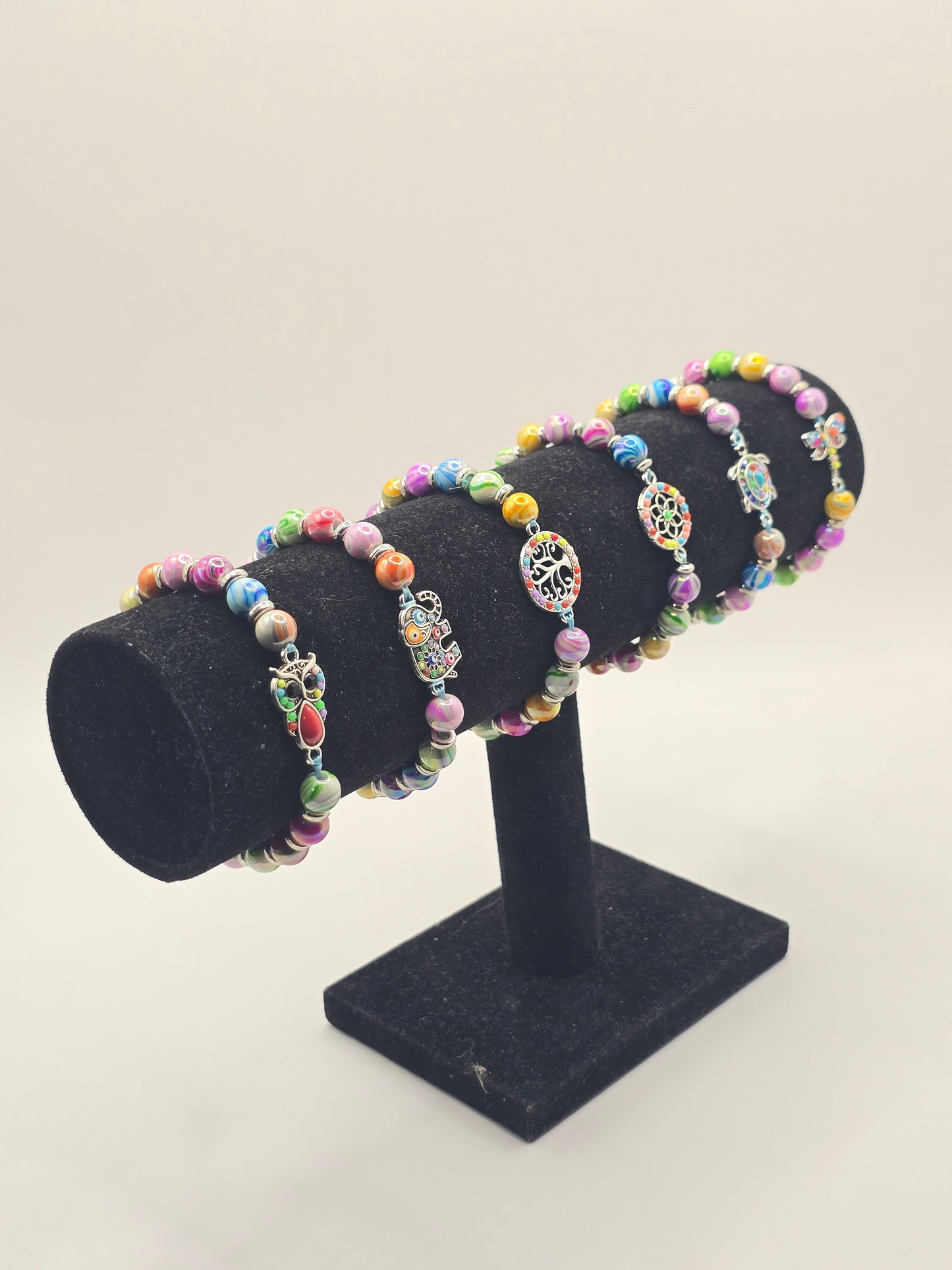 Kids beaded bracelet, multicoloured elastic bracelet with various colourful charms