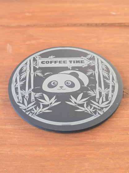 Circular coaster with panda design and 'Coffee Time' text on a wooden surface