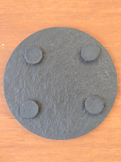 underside of a slate coaster with 4 felt feet