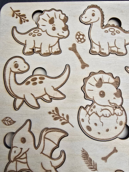 Wooden cutout shapes of dinosaurs and nature elements on a wooden background
