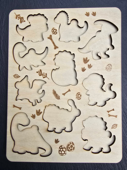 Wooden puzzle with dinosaur cut outs and decorative elements