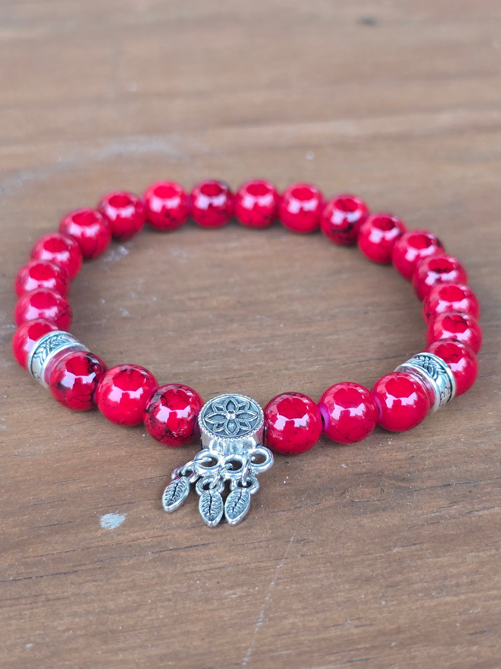 soft focus shot of a shiny red beaded bracelet for women