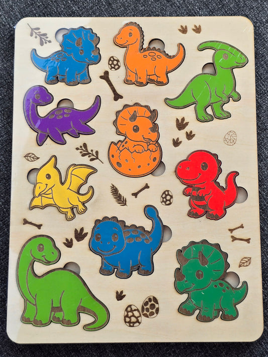 Wooden puzzle with colorful dinosaur shapes on a beige board