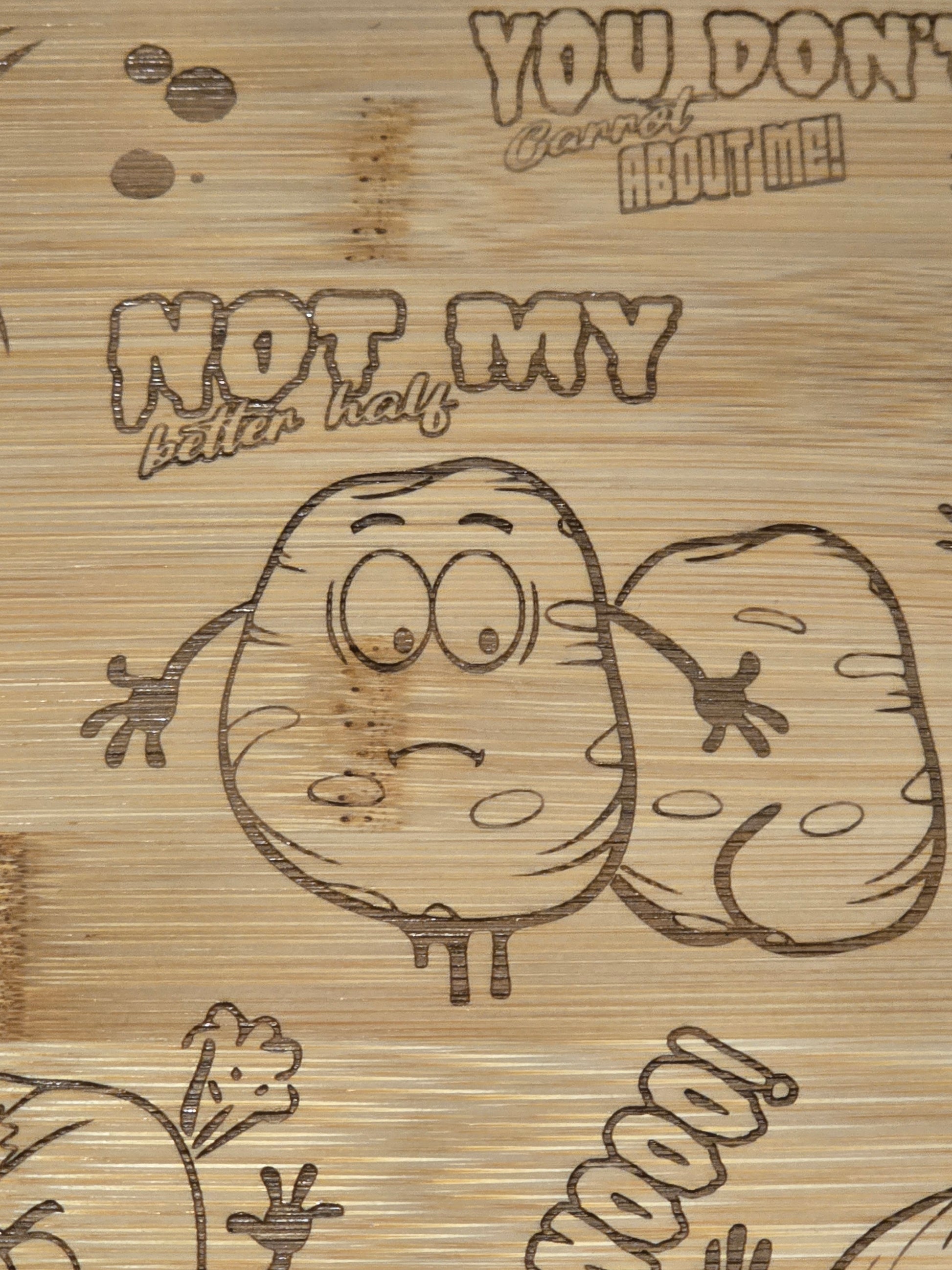 Cartoon potato character with text on a wooden chopping board