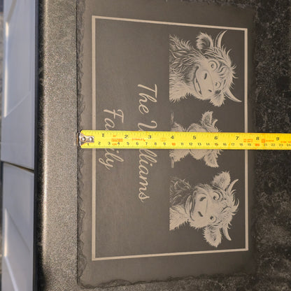 Slate with cow illustration and 'The Williams Family' text, measured by a tape measure showing 21cm width