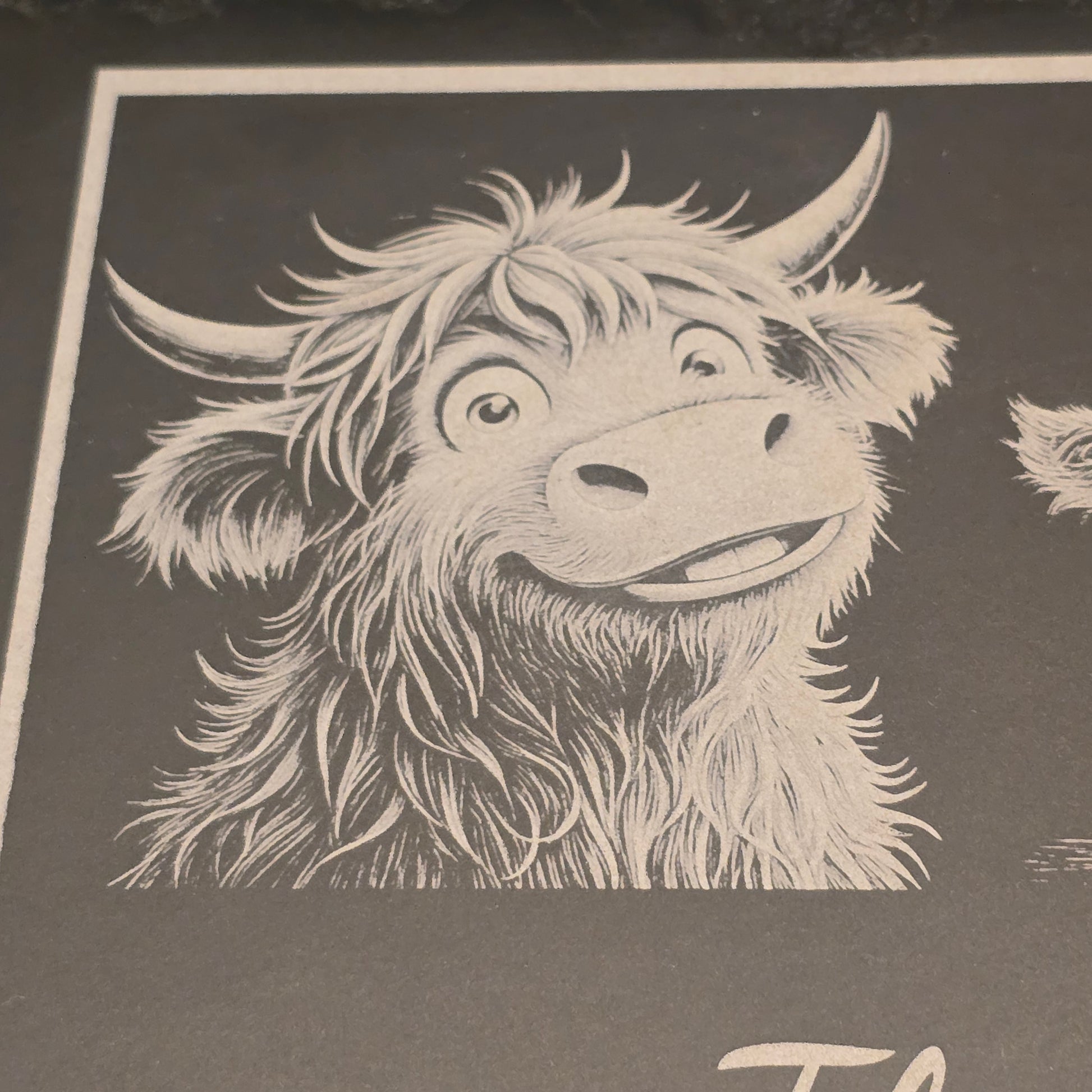 Illustration of a cute highland cow on a slate