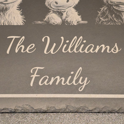 Decorative sign with personalised 'The Williams Family' text and highland cow designs