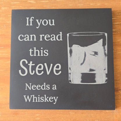 custom drinks mat with a glass of whiskey and text on a wooden surface