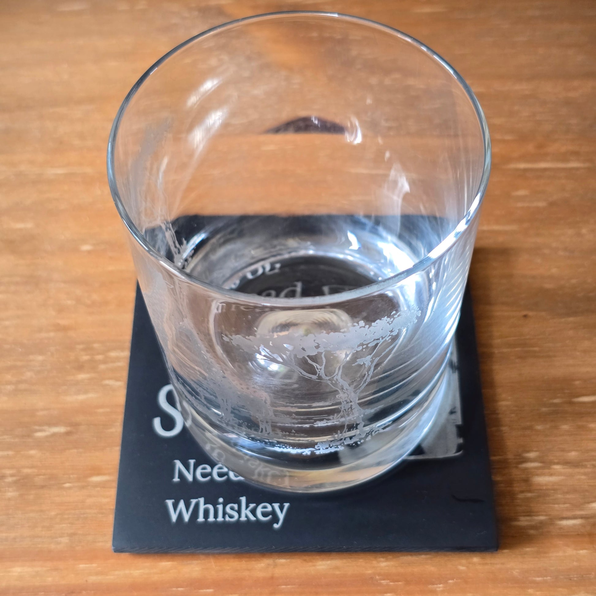 whiskey glass on a personalised coaster