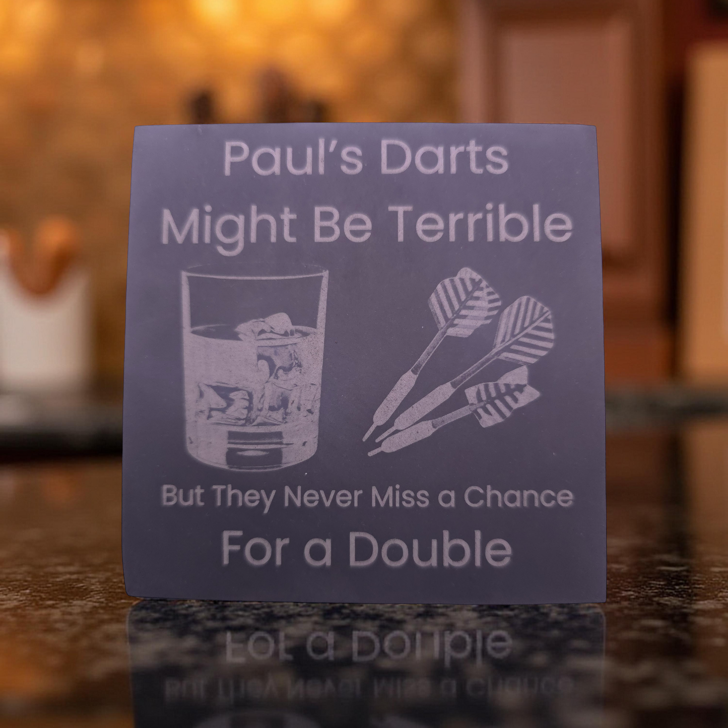 personalised slate coaster with the slogan "Pauls darts might be terrible, but they never miss a chance for a double"