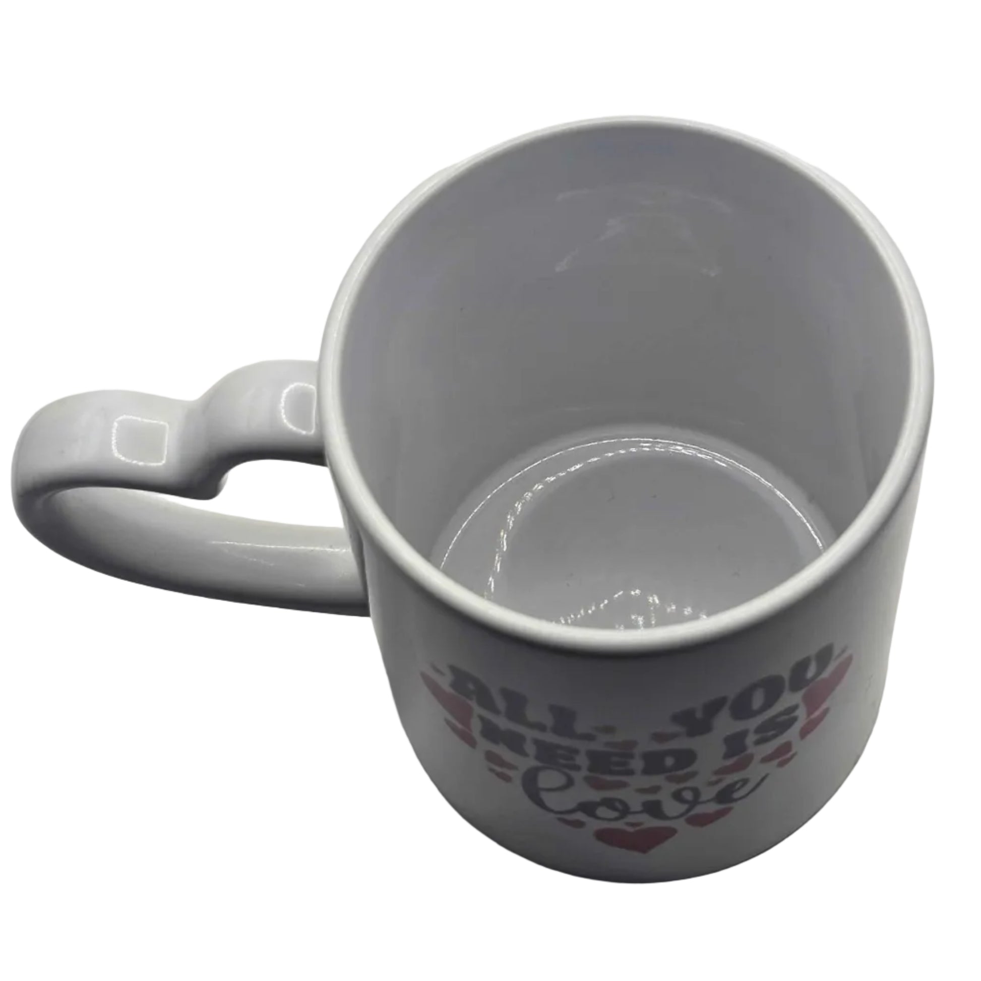 Gray mug with text 'All you need is love' on a white background