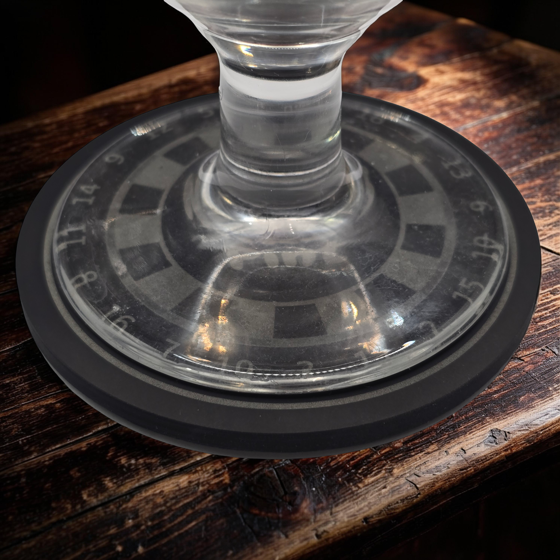 dartboard slate coaster with a pint glass on top 