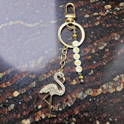Rhinestone Flamingo keychain with gold accents and personalised lettering spelling Jenny